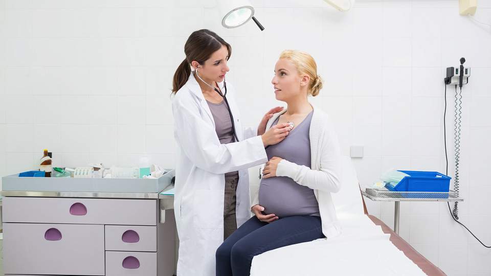 Pregnant woman getting examined