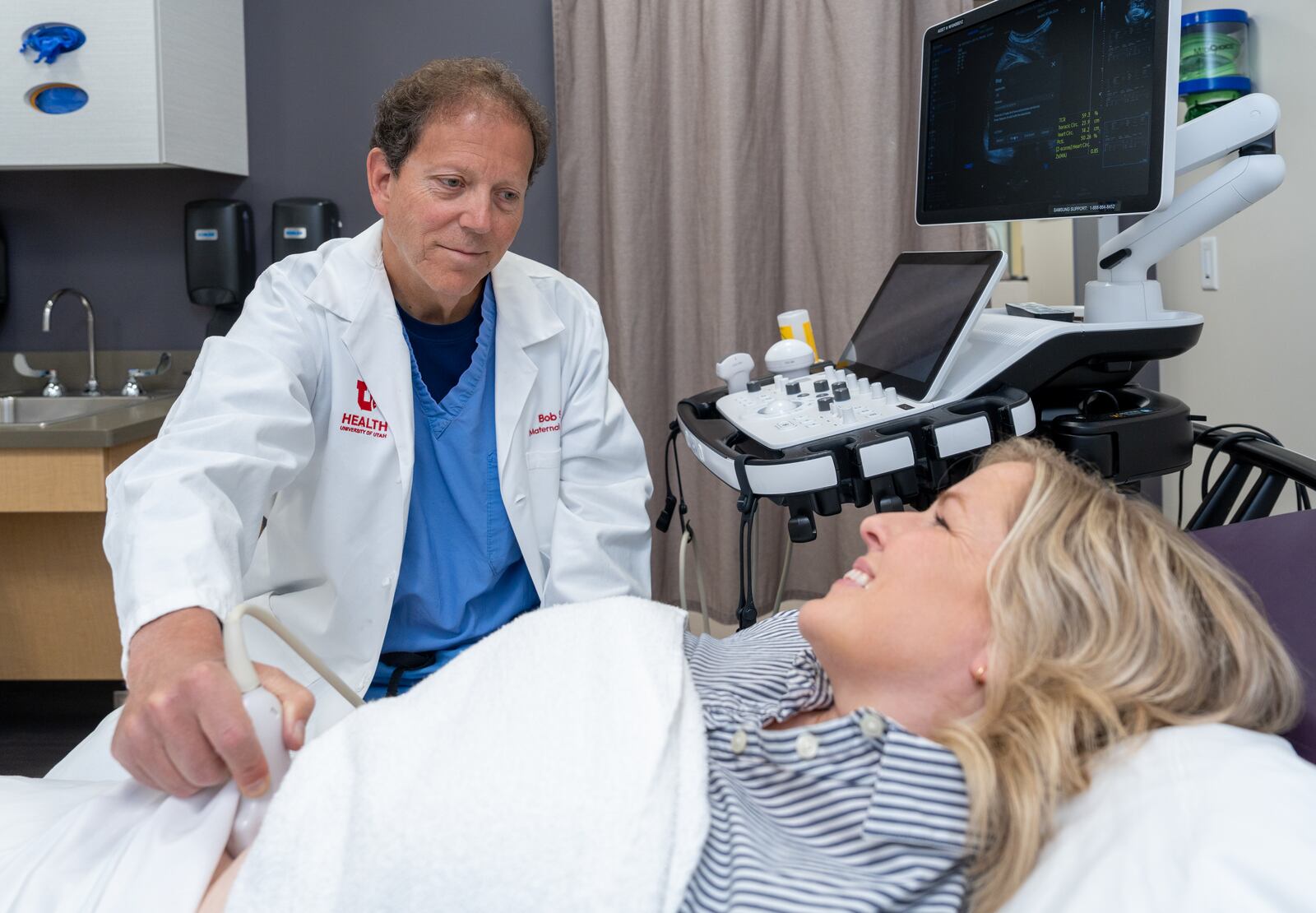 Dr. Bob Silver examines a patient in the Utah Pregnancy After Loss Program at University of Utah Health..